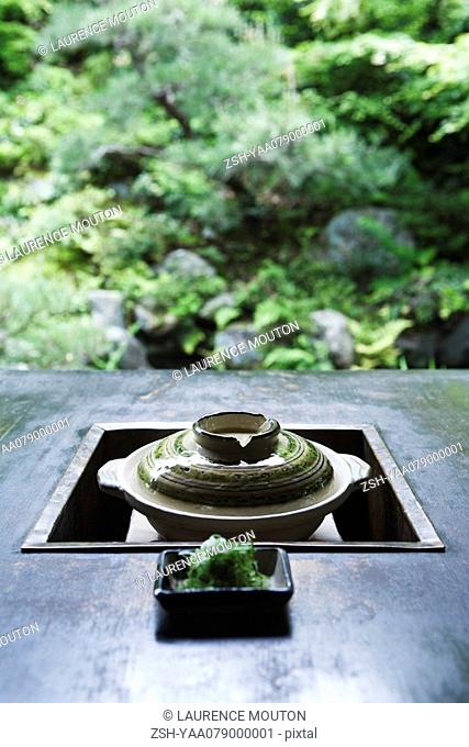 Japanese brazier, with dish of green soy noodles