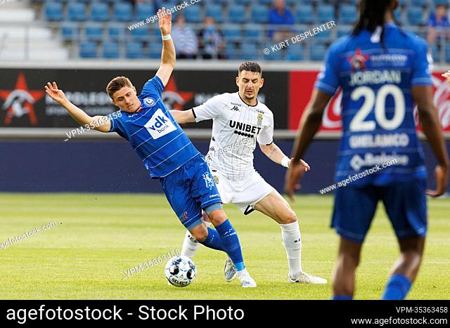 Gent's Alessio Castro Montes and Charleroi's Stefan Knezevic fight for the ball during a soccer match between KAA Gent and Sporting Charleroi