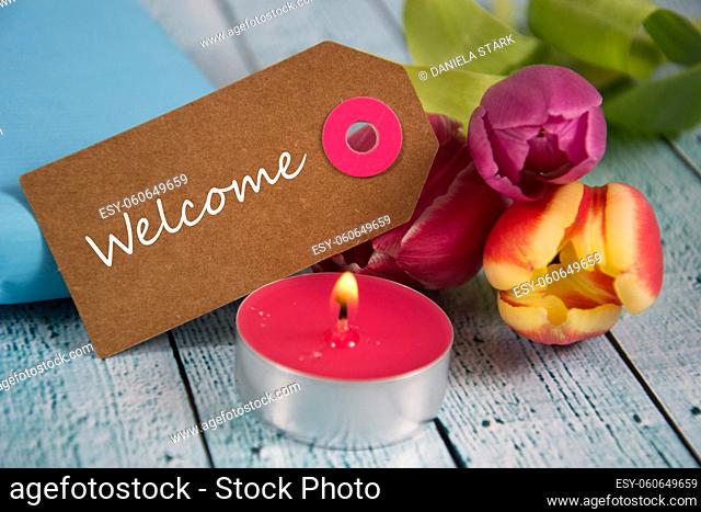 Welcome sign with tulips