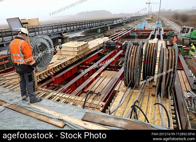16 December 2020, Mecklenburg-Western Pomerania, Tribsees: Work on the new bridge on the subsided A 20 Baltic motorway is in full swing