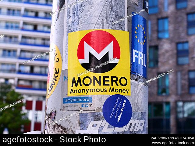 21 August 2022, Berlin: Aug. 21, 2020, Berlin. A sticker advertises ""Monero, "" a blockchain-based cryptocurrency. Monero assures users a relatively high...