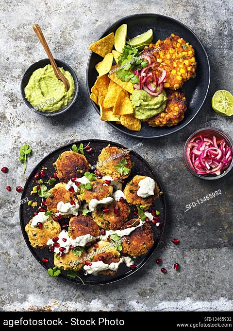 Corn fritters with guacamole and nachos, bean patties with coriander, pomergranate and creamy sauce