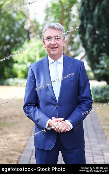 30 August 2022, North Rhine-Westphalia, Bonn: Andreas Mundt, President of the German Federal Cartel Office, stands in the authority's garden