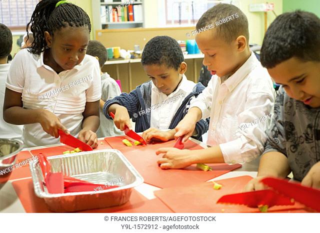 As part of National Food Day, second and third graders participate in a Plant Part Pizza cooking session at Columbia University's Teachers College in New York...