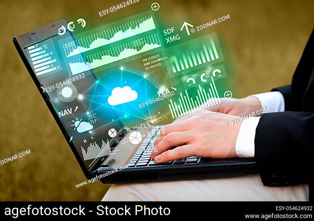 Hand using laptop with cloud technology and linked information concept