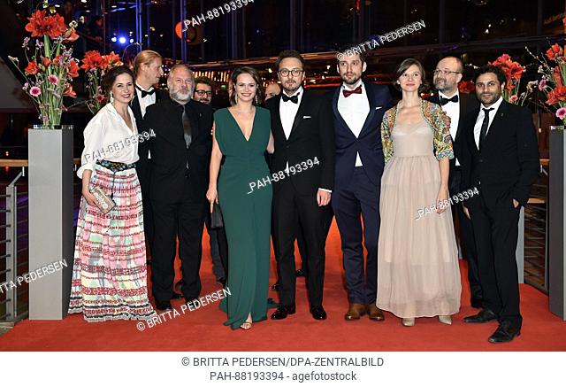 Actress Diana Cavallioti (center l), director and screenwriter Calin Peter Netzer (c), actor Mircea Postelnicu (4th r) and cast members