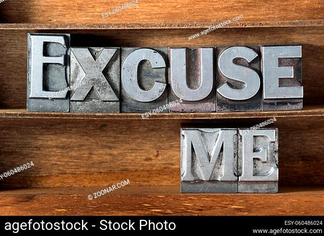 excuse me phrase made from metallic letterpress type on wooden tray
