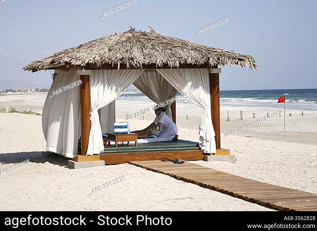 Massage on the beach at Hilton hotel in Salalah, Oman. Photo by André Maslennikov