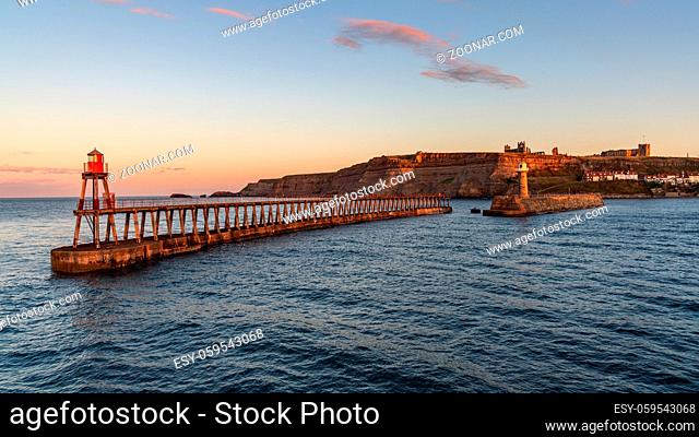 Whitby, North Yorkshire, England, UK - with the East Pier Lighthouse, seen from West Pier