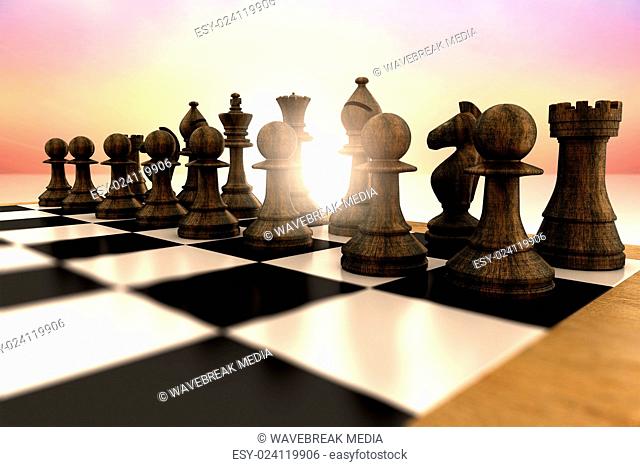 Composite image of black chess pieces on board