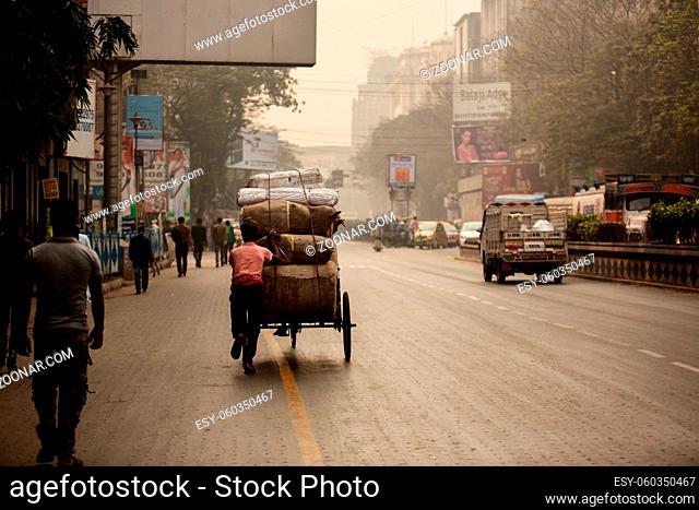Calcutta (Kolkata ), India-January 21, 2019: Yellow cabs and hand-pulled rickshaws are very commonly used in Calcutta..Most of the Indian also uses colorful...