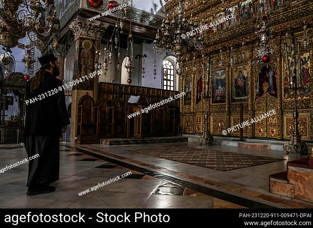 20 December 2023, Palestinian Territories, Bethlehem: An interior view of the Church of the Nativity without any visitors after the Christmas celebrations were...