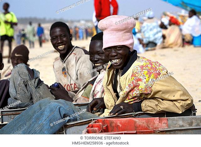 Senegal, Thies Region, Kayar, the beach and fishing harbour, young dockers in the fishing business