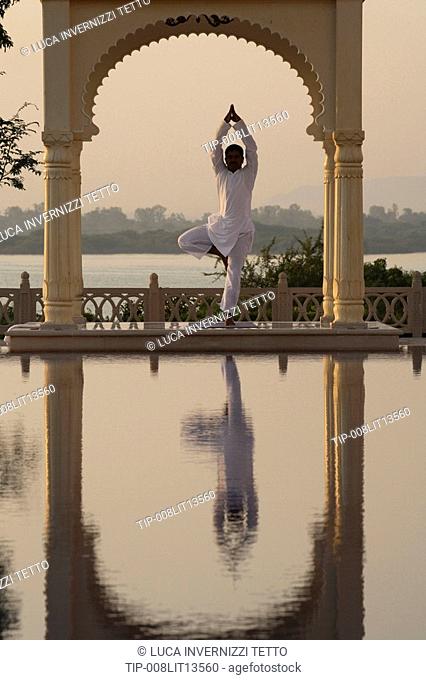 India, Udaipur, Rajastan, Uberoi Udai Vilas Hotel, man doing yoga