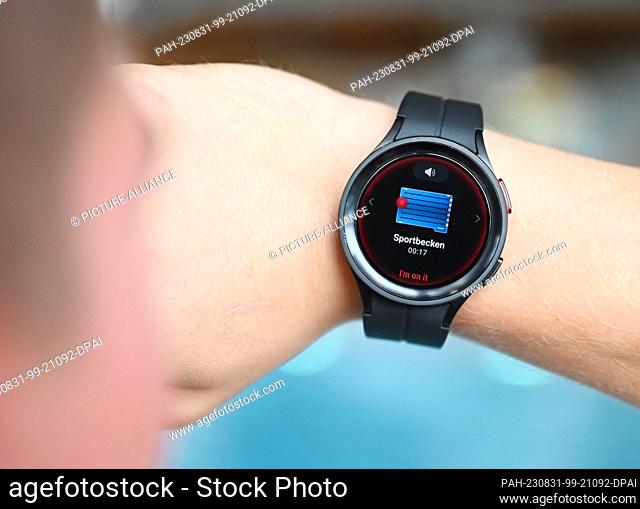 PRODUCTION - 28 August 2023, Baden-Württemberg, Freudenstadt: At the Panorama pool in Freudenstadt, a smartwatch is on display which