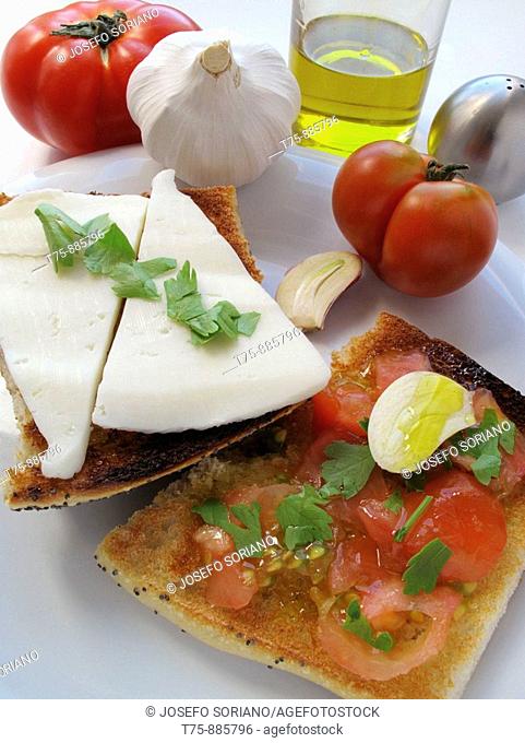 Toast with olive oil, garlic, sweet tomato and cheese