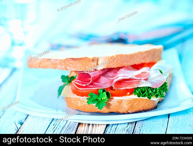 sandwich with ham and vegetables on the plate