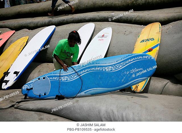 A participant collects surf board to join the 6th Surf Classic Tournament at Kolatoli Beach in CoxÆs Bazar Surf the Nations organized this tournament More than...