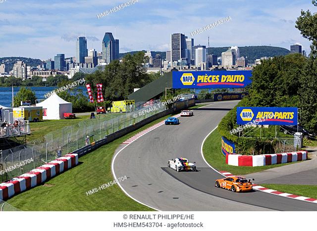 Canada, Quebec Province, Montreal, NASCAR race at the Circuit Gilles Villeneuve on Ile Notre Dame, in the background the downtown skyscrapers