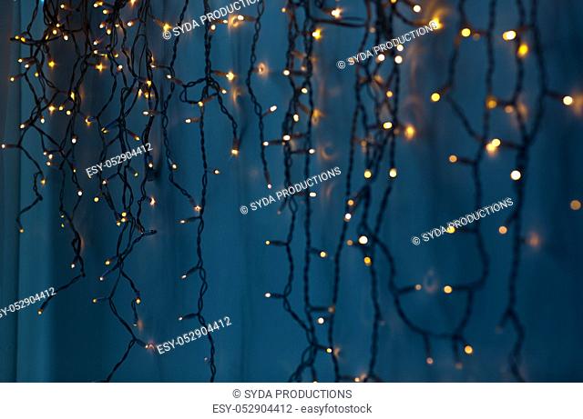 christmas garland lights over dark blue background