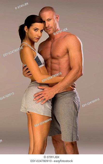 Very Seductive Young Couple in Body Fitness Pose. Emphasizing Possible Perfect Body for Partners