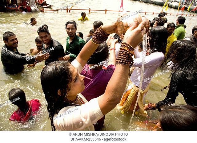 Transgender bathing in kshipra river, madhya pradesh, india, asia