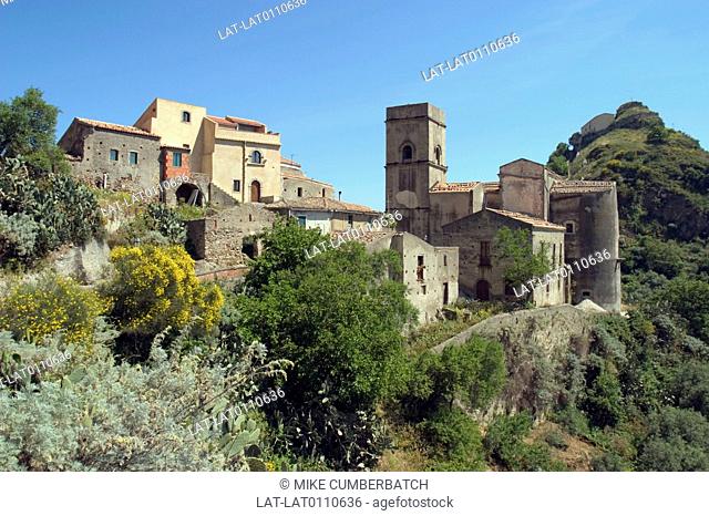 Hilltop village with medieval buildings. Chiesa Madre church tower