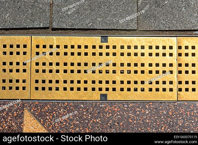 Brass Water Drainage at Pavement Tiles