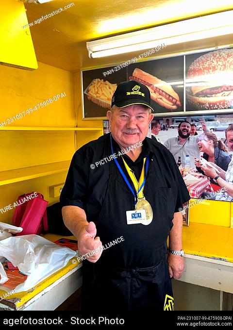 07 October 2023, France, Arras: Prominent northern French fry restaurateur Jean-Paul Dambrine stands in the original fry cart he made for the movie ""Welcome to...