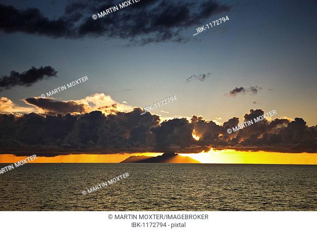 Sunset behind Silhouette Island, La Digue Island, Seychelles, Indian Ocean, Africa