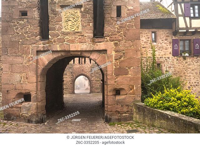 medieval rampart and town gate of village Riquewihr, touristy site of the Alsace Wine Route, France