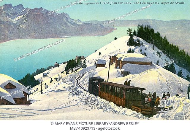 Tourists visiting a mountain summit by train near Caux, Switzerland. Showing Lake Geneva (Lac Leman) and the Savoy Alps