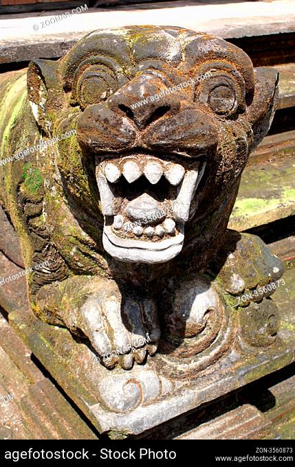 Lion with teeth on the staircase, Tirta Empul, Bali