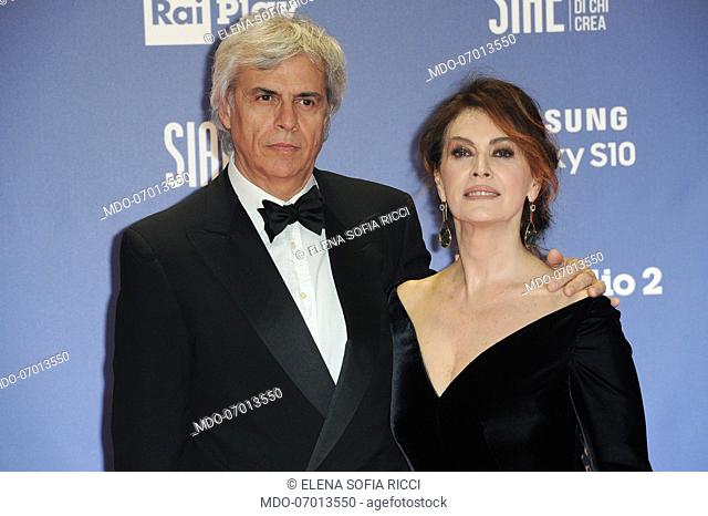 Italian actress Elena Sofia Ricci with her husband, Italian compositor and conductor, Stefano Mainetti during the red carpet of the 64th edition of the David di...
