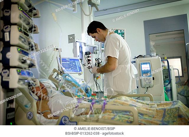 Reportage in Robert Ballanger hospital's Intensive Care Unit in France. A nurse looks after a curarised patient