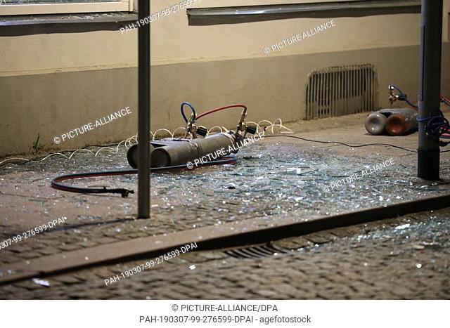 07 March 2019, Thuringia, Gera: Gas cylinders are located in front of the entrance area of a bank. Two men blew up an ATM in the bank vestibule and took money