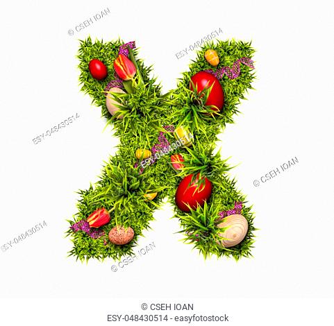 Easter holiday letter X made of fresh green grass and Easter eggs isolated on white background