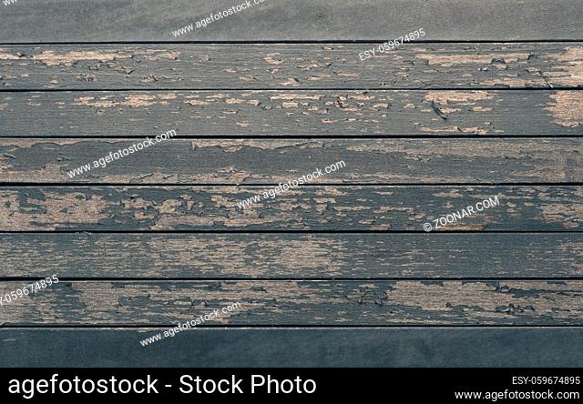Old wood planks with peeling paint, rustic background or header with space for text