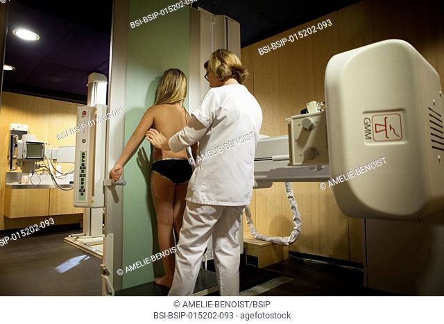 Reportage in a radiology centre in Haute-Savoie, France. A technician carries out an x-ray on a young girl suffering from scoliosis