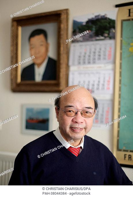 Chinese businessman Martin Chen is pictured in front of a portrait of his father Chen Chunching at the office of the Home for Chinese Sailors in Hamburg