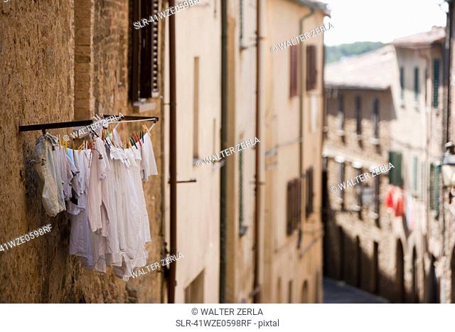 Laundry hanging from apartment window