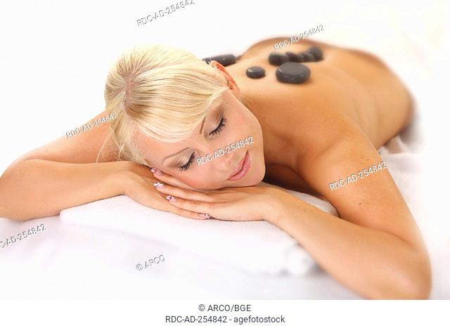Woman at hot stone massage hot stones basalt la stone therapy LaStone therapy