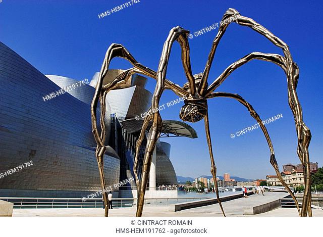 Spain, Biscaye province, Spanish Basque Country, Bilbao, Guggenheim Museum by architect Frank Gehry and the spider shaped sculpture by Louise Bourgeois entitled...