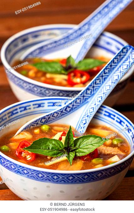 chinese sweet and sour soup on wood