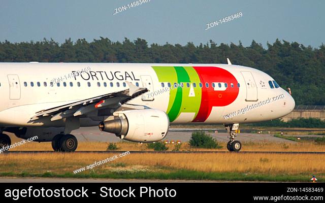 FRANKFURT AM MAIN, GERMANY - JULY 18, 2017: TAP Air Portugal Airbus A321 CS-TJF begin accelerates taking off at runway18. Fraport, Frankfurt, Germany