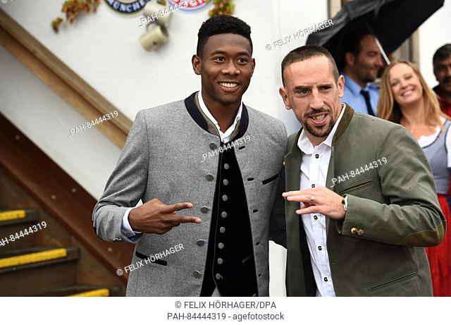 FC Bayern players David Alaba (L) and Frank Ribery can be seen in front of the Kaefer tent at the arrival for the FC Bayern Oktoberfest at Oktoberfest in Munich