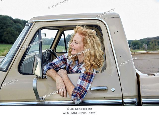 Smiling woman in pick up truck