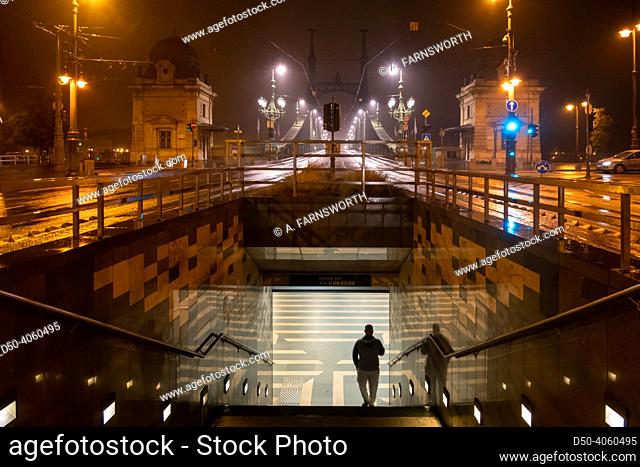 Budapest, Hungary A man descends at night into a passage down into the FŠ‘vám tér Metro station