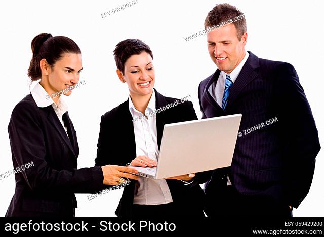 Happy young businesspeople looking at laptop computer screen, laughing. Isolated on white