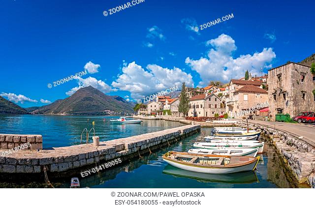 Anchored boats on the shore in the beautiful Perast town in the Kotor Bay, Montenegro